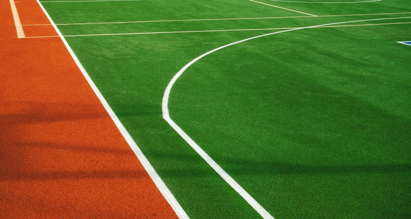 Sports Field Artificial Turf Aerial view of a playground featuring artificial turf and playground equipment