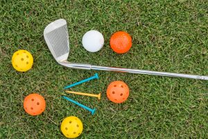 Golf Ball and Golf Club on artificial grass for driving ranges